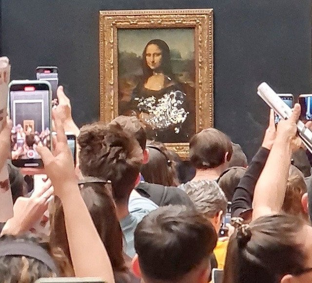 WATCH: Mona Lisa painting smeared in cream in climate protest stunt