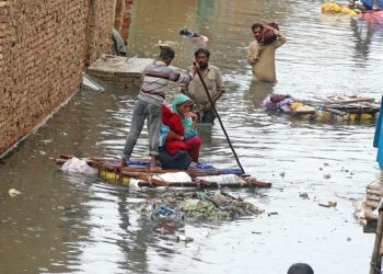 HYDERABAD: Rain affected people facing problems due to rain water inundated in their houses and use temporary boats for coming out from their houses at Mehar Ali Society after heavy rains, in the city.