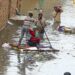HYDERABAD: Rain affected people facing problems due to rain water inundated in their houses and use temporary boats for coming out from their houses at Mehar Ali Society after heavy rains, in the city.