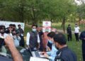 Excise director visits mobile vehicle registration center, reviews arrangements