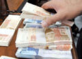 Rupee spread widens to record