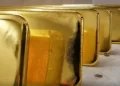 Gold extends losses on rupee strength, traders watchful of positive cues