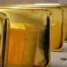 Gold extends losses on rupee strength, traders watchful of positive cues
