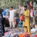 MULTAN:  Women customers selecting hand bags from a roadside vendor