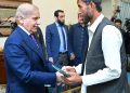 Muhib Ullah Kakar, an excavator driver who saved a family stranded in flash flood in Qilla Abdullah calls on Prime Minister Muhammad Shehbaz Sharif. Islamabad, 4 September, 2024.