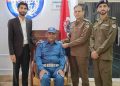 Sialkot: District Police Officer Rana Umar Farooq is inducting Sub-Inspector Saif Ali for promotion.