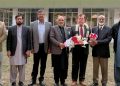 Private Schools Network founder and central president Dr. Muhammad Afzal Babar and other directors of the National Curriculum Council presenting a bouquet to Dr. Shafqat Ali Janjua on his retirement.