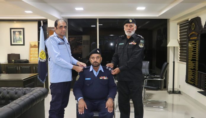 Rank pinning ceremony honors promoted officers at Security Division